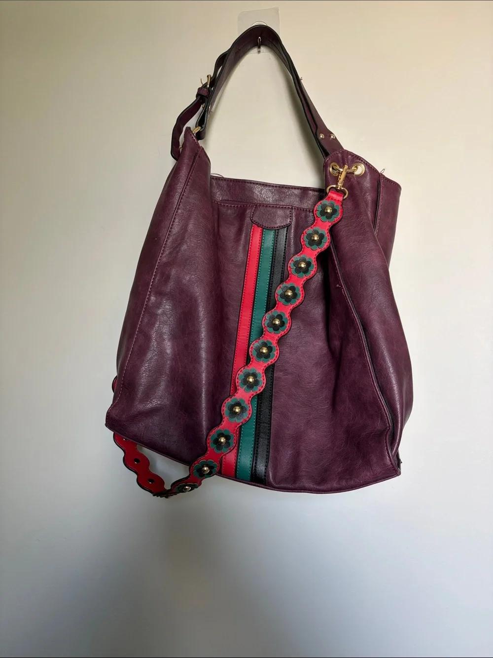 Large Burgundy leather bag with red and green accents